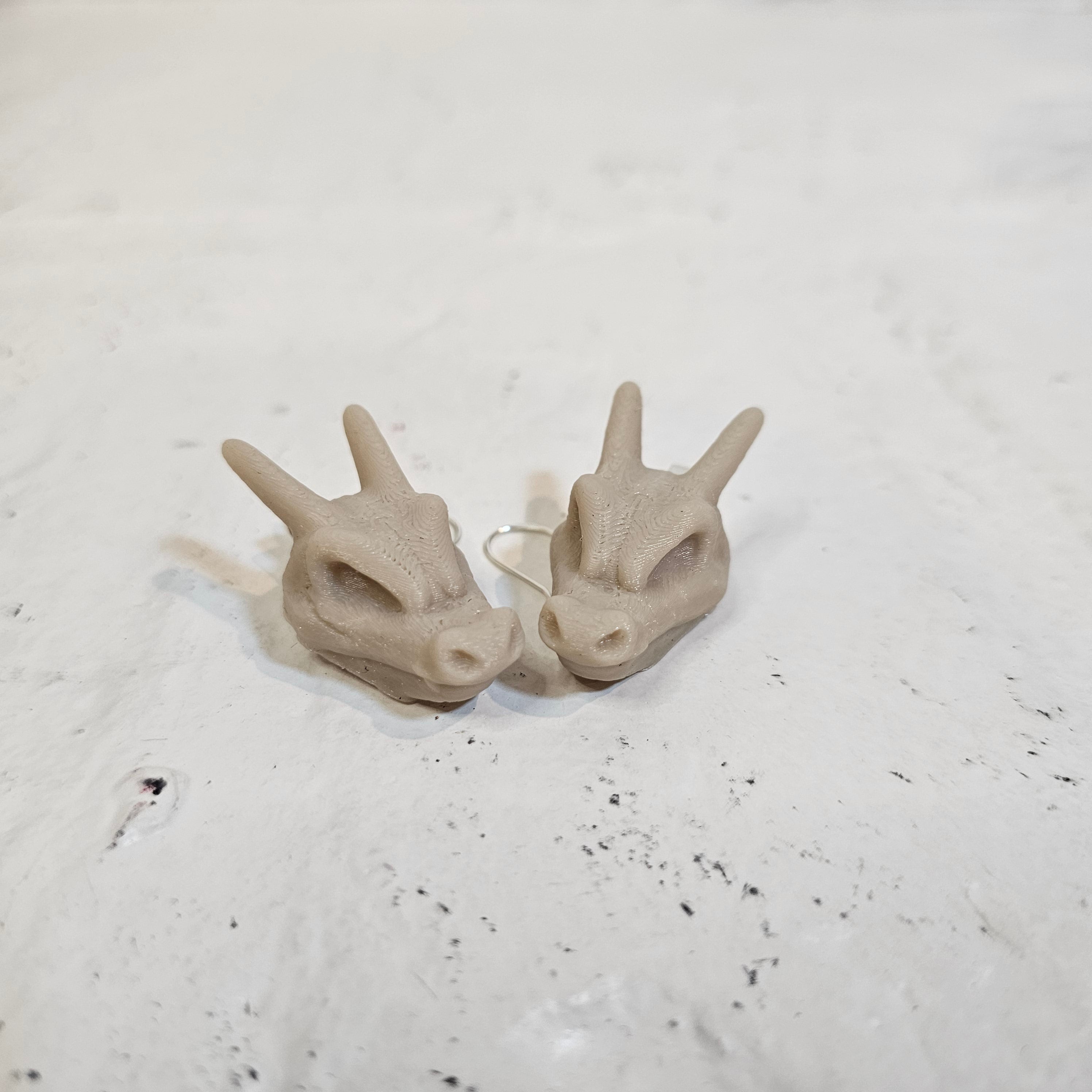 Charizard skull earrings